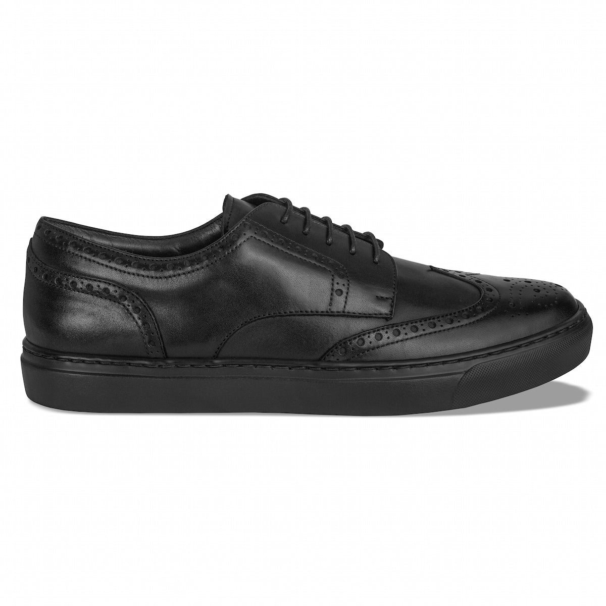Side view of MOCALMO Aida women's black leather wingtip sneakers featuring brogue perforations, black laces and matching black soles.