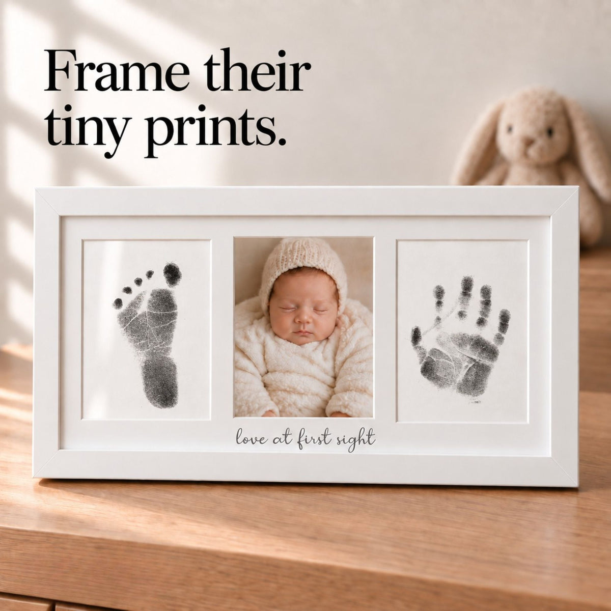 Little Treasures white wooden 3-panel baby keepsake frame displaying newborn handprint, baby photo, and footprint with Love at First Sight engraving.