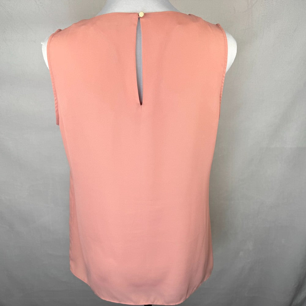Back view of Banana Republic Peach-colored sleeveless top on a mannequin against a gray background