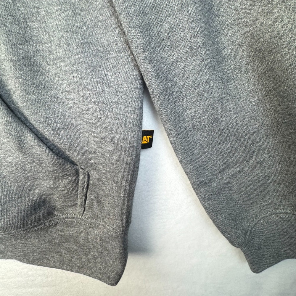 Side view of CAT gray hoodie with a brand logo size m
