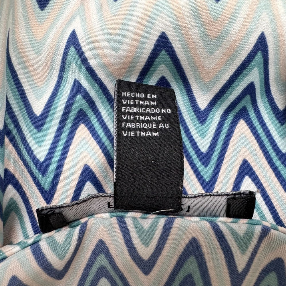 Clothing tag view on Forever 21 tank top Text label on a zigzag patterned fabric