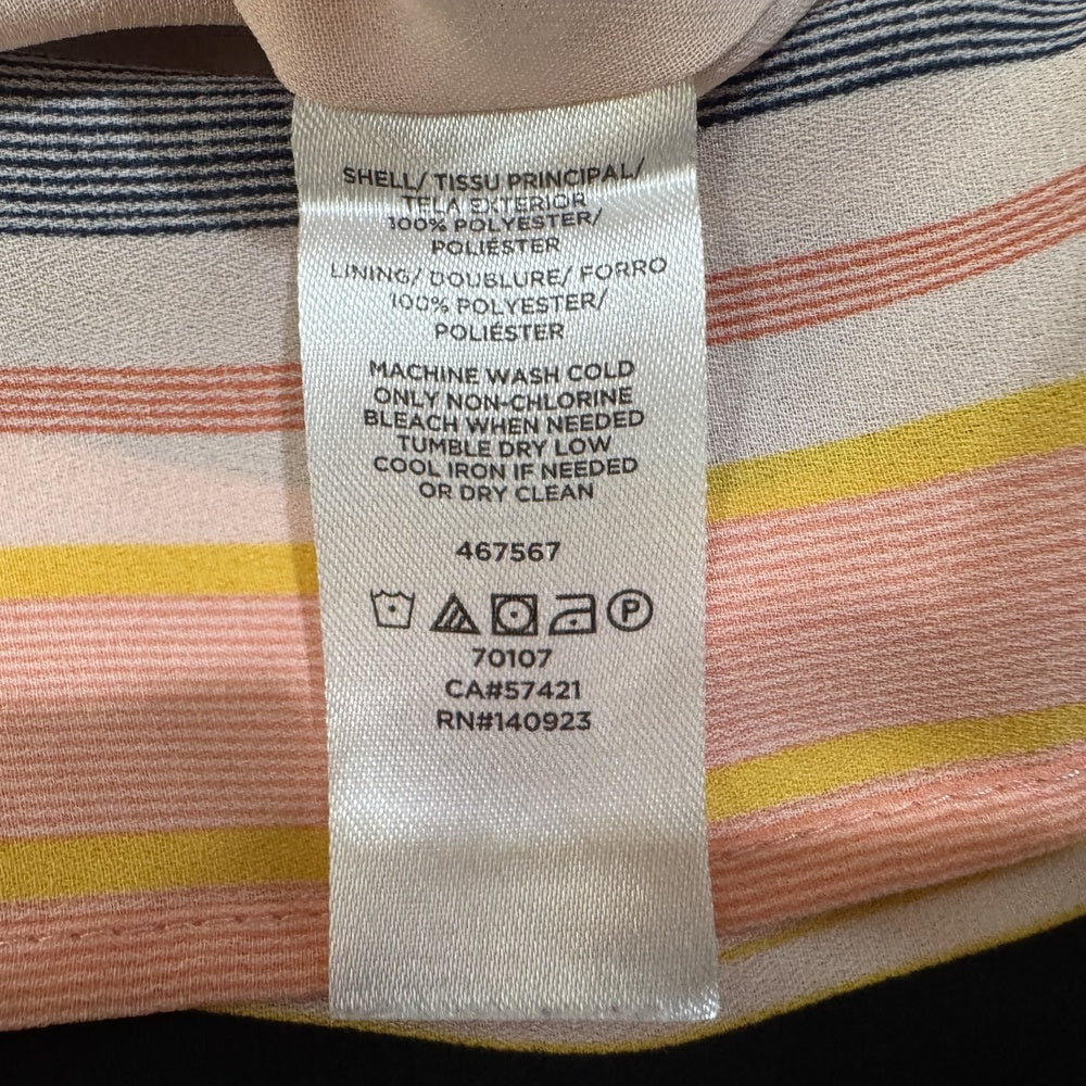 Clothing material tag view of Loft striped garment with washing instructions.