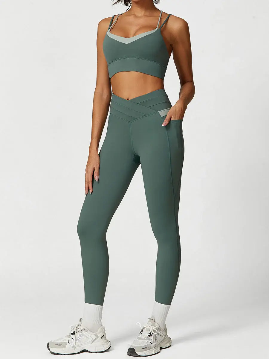 Model wearing sage green ContourFlex two-tone high-waisted workout leggings with crossover waistband and side pockets, paired with matching sports bra.