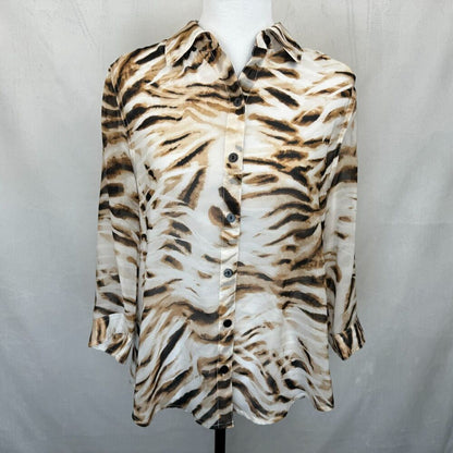 A long-sleeve button-up shirt with a brown and black tiger stripe pattern on a cream background, displayed on a white mannequin torso against a light gray fabric backdrop.