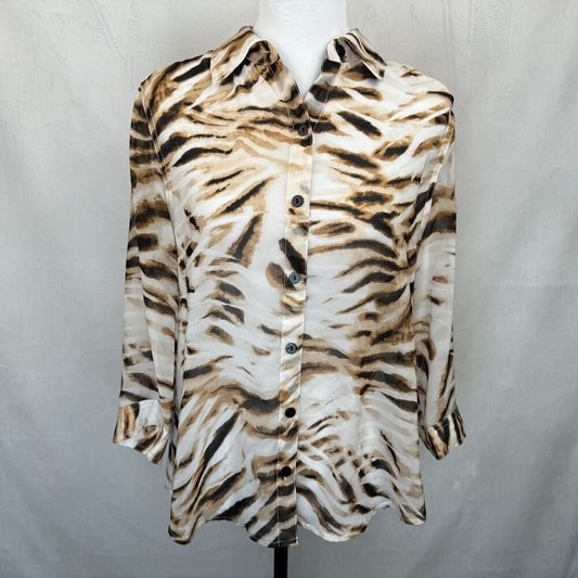 A long-sleeve button-up shirt with a brown and black tiger stripe pattern on a cream background, displayed on a white mannequin torso against a light gray fabric backdrop.