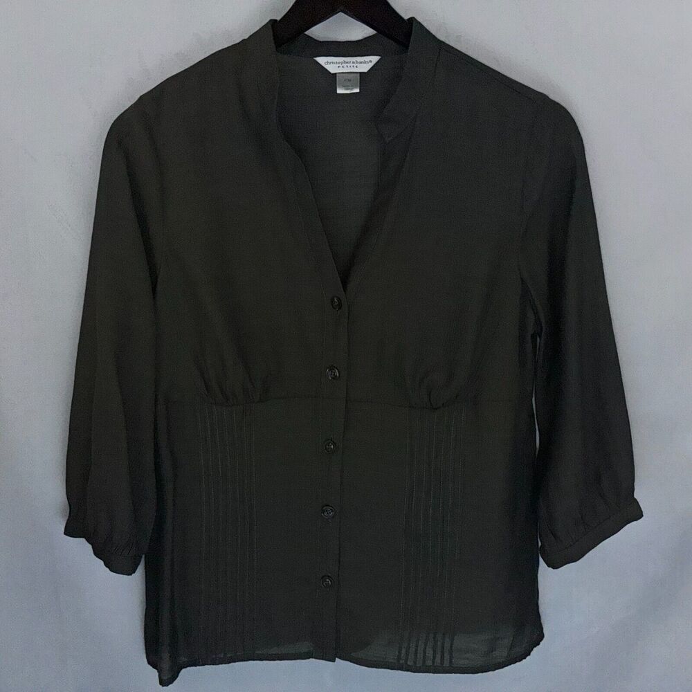 A dark olive green button-up blouse with three-quarter sleeves and gathered detailing, hanging on a black hanger against a light gray background.