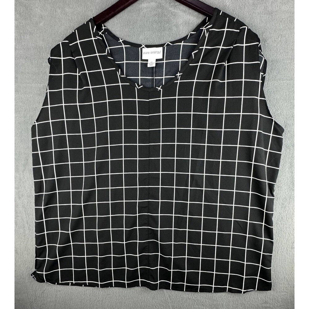 A sleeveless black top with a white windowpane grid pattern, hanging on a dark wooden hanger against a textured gray background.