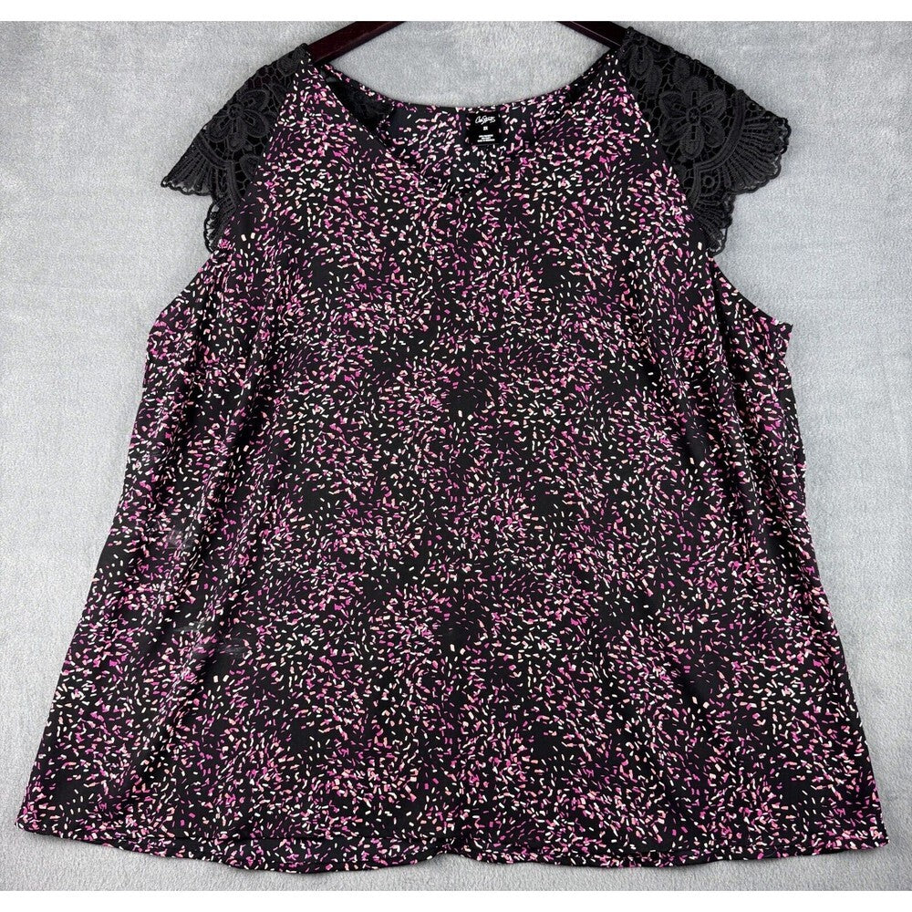 A women's sleeveless top with a black and pink floral print, featuring black lace flutter sleeves, laid flat on a light gray textured background.