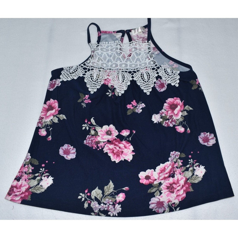 A sleeveless floral dress with a navy blue base, featuring pink and white rose patterns, a white lace-trimmed neckline, and thin shoulder straps, laid flat on a light gray background.