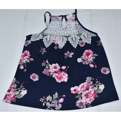 A sleeveless floral dress with a navy blue base, featuring pink and white rose patterns, a white lace-trimmed neckline, and thin shoulder straps, laid flat on a light gray background.