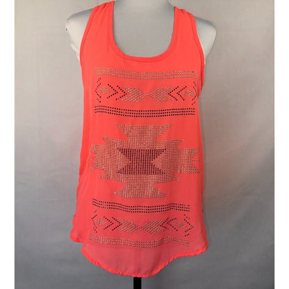 A bright coral orange sleeveless tank top with a scoop neck, displayed on a white mannequin torso against a neutral gray background. The top features a Southwestern-style geometric pattern made of sparkling rhinestones in horizontal bands across the chest and lower skirt.