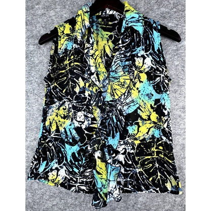 A sleeveless collared shirt with a vibrant tropical leaf print in black, yellow, and turquoise blue, hanging on a dark hanger against a gray textured background.