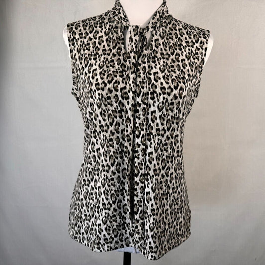 A sleeveless leopard-print blouse displayed on a white dress form against a light gray fabric backdrop.