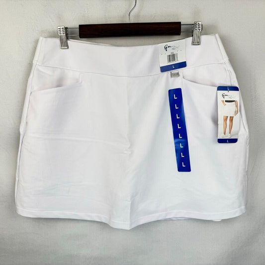 A pair of white women's shorts hanging on a dark wooden hanger against a light gray wall. The shorts feature side pockets and are shown with retail tags, including a blue size guide and a brand tag that appears to read 'G&G'.