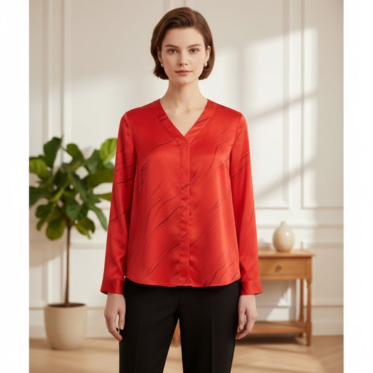 Alfani women’s red V-neck long sleeve button-front blouse with subtle abstract print, shown untucked with black pants.