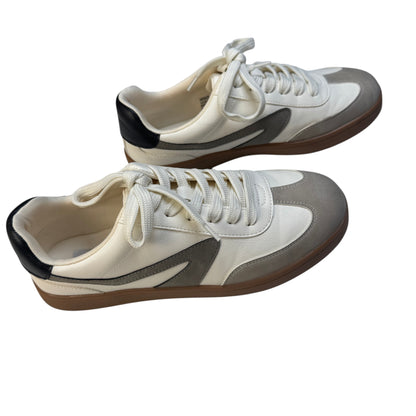 Side profile view of Dolce Vita Voyage ivory and beige suede retro sneakers