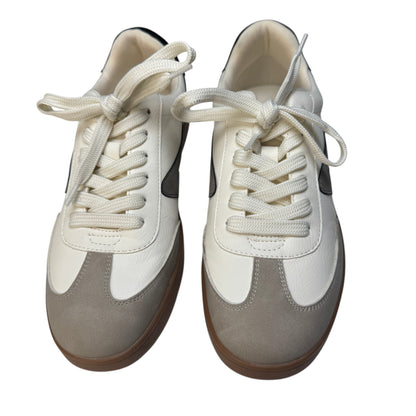 Pair of Dolce Vita Voyage sneakers in ivory, beige, and charcoal from the front.