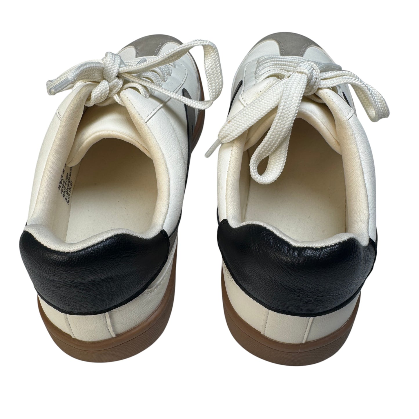 Black leather heel tab detail on Dolce Vita Voyage mixed-media sneakers.