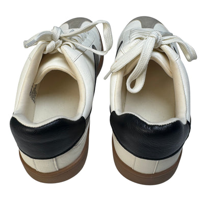 Black leather heel tab detail on Dolce Vita Voyage mixed-media sneakers.