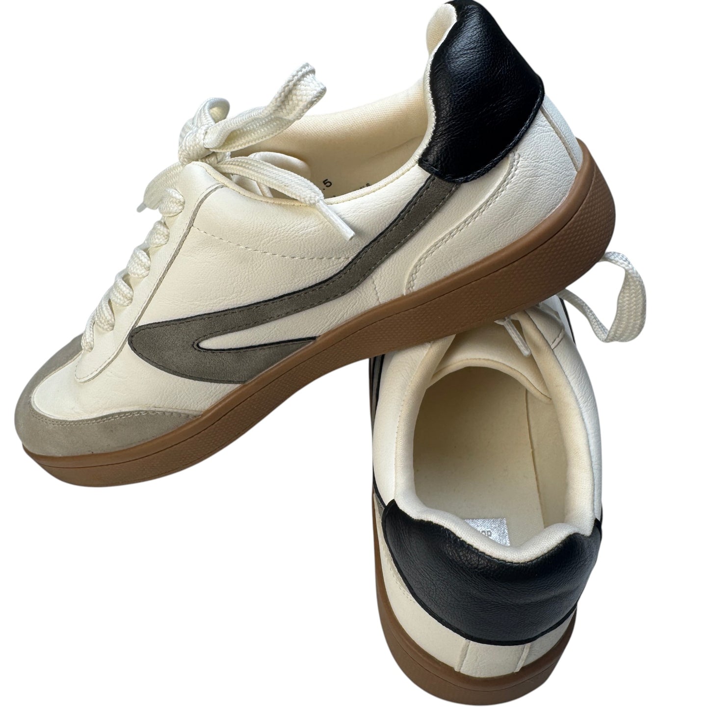 Pair of Dolce Vita Voyage sneakers in ivory, beige, and charcoal from the front.