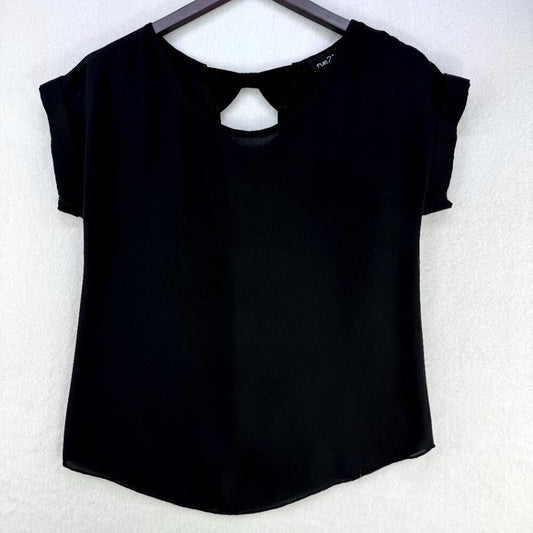 A black short-sleeve top with a keyhole cutout at the neckline, hanging on a dark hanger against a textured white wall.