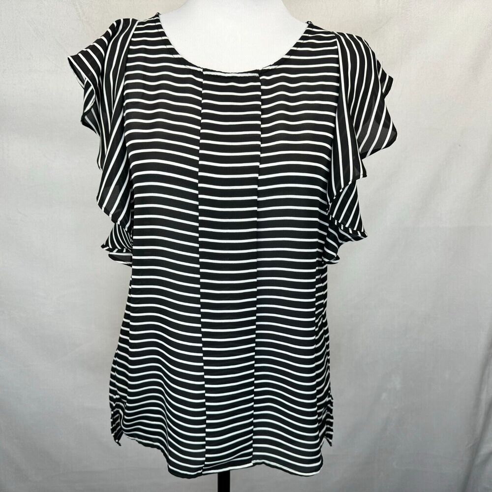 A black and white horizontally striped blouse with ruffled cap sleeves, displayed on a white mannequin torso against a light gray fabric backdrop.