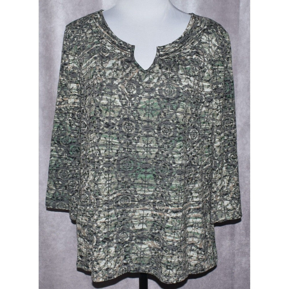 A women's three-quarter sleeve top with a split keyhole neckline, featuring an abstract green, gray, and black pattern, displayed on a mannequin torso against a gray backdrop.