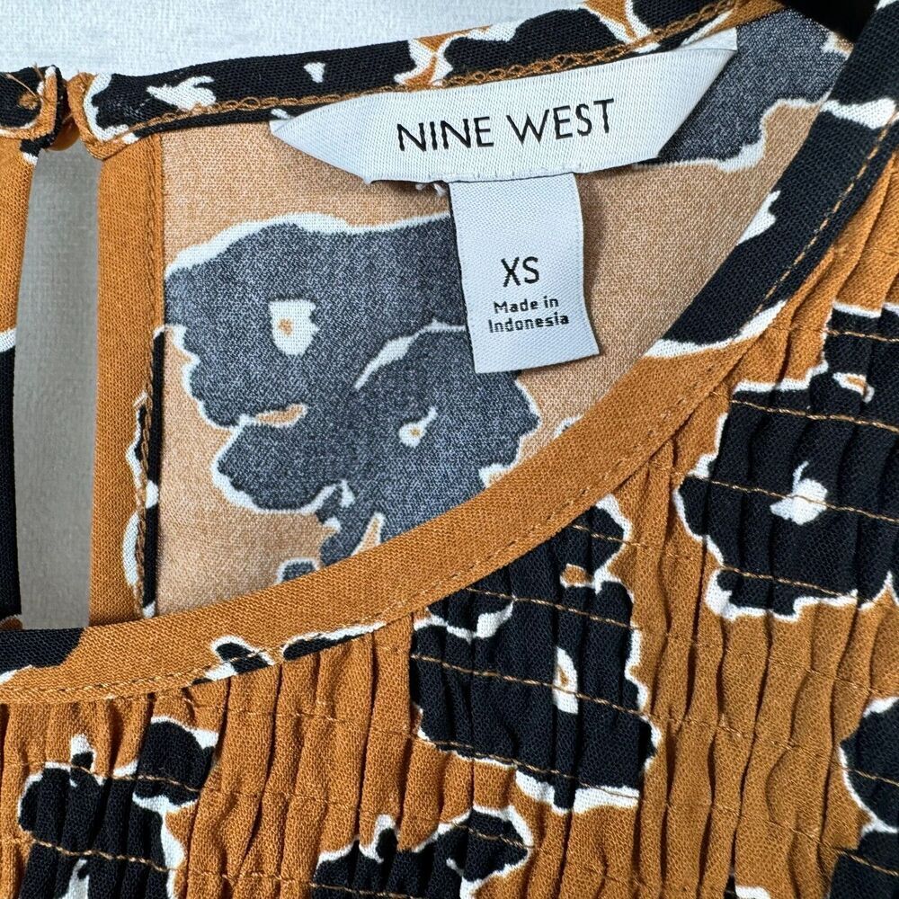 NINE WEST Blouse Sz XS Smocked Brown Animal Print Peplum Hem ruched top