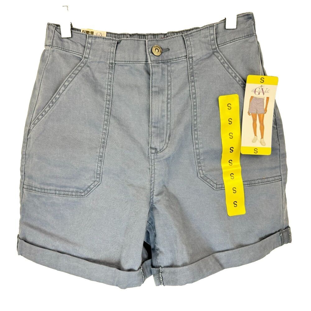 Light blue denim shorts with a button closure, front pleats, and rolled cuffs, shown with a yellow Gildan size tag attached on a white background.