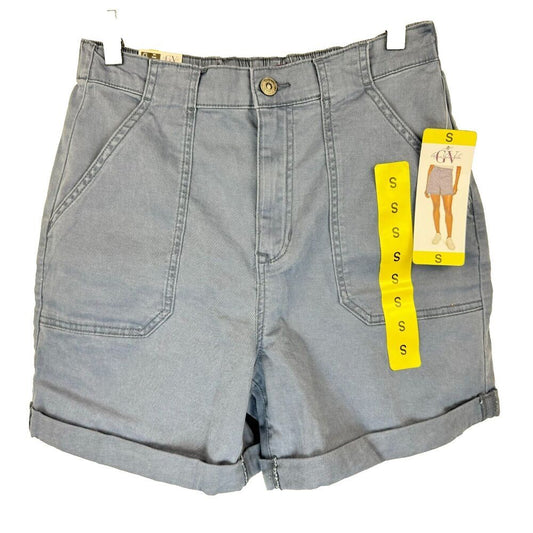 Light blue denim shorts with a button closure, front pleats, and rolled cuffs, shown with a yellow Gildan size tag attached on a white background.