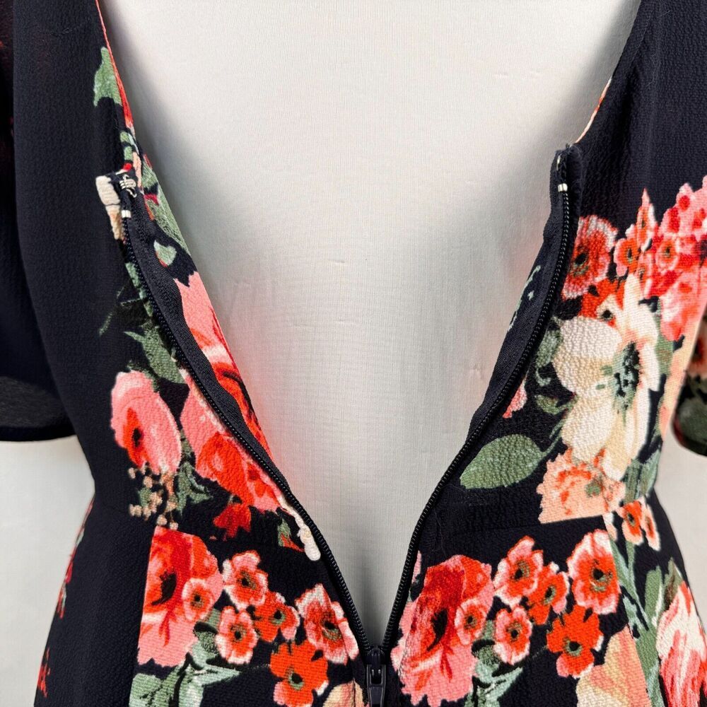 Trixxi Clothing Co Romper Sz S Black Navy Floral Ruffled Sleeve Surplice Wrap