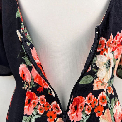 Trixxi Clothing Co Romper Sz S Black Navy Floral Ruffled Sleeve Surplice Wrap