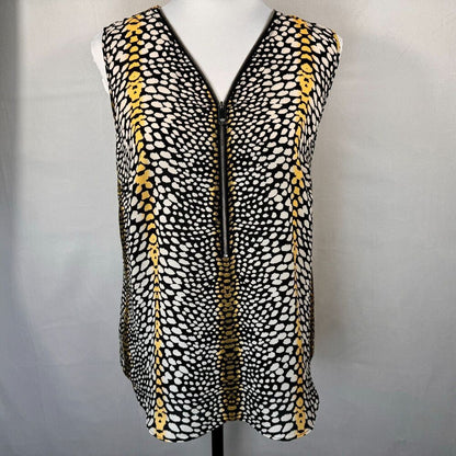 A sleeveless black vest with a white and yellow spotted pattern, featuring a front zipper, displayed on a white mannequin torso against a light gray background.