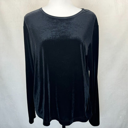 A black long-sleeve velvet top displayed on a white mannequin torso against a light gray fabric backdrop.