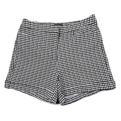 Black and white houndstooth patterned shorts, laid flat on a white background.