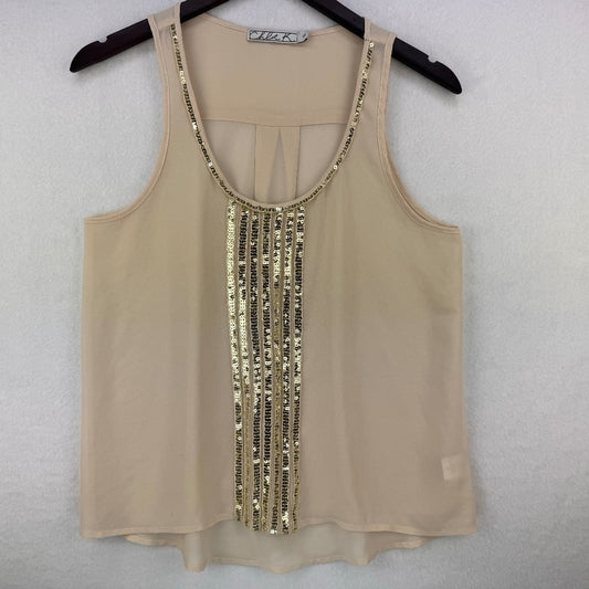 A beige sleeveless mesh top with gold sequin trim along the scoop neckline and center front, hanging on a black hanger against a light gray textured wall.