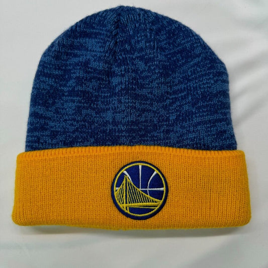 A blue and gold knit beanie hat featuring the Golden State Warriors logo embroidered on the front cuff.
