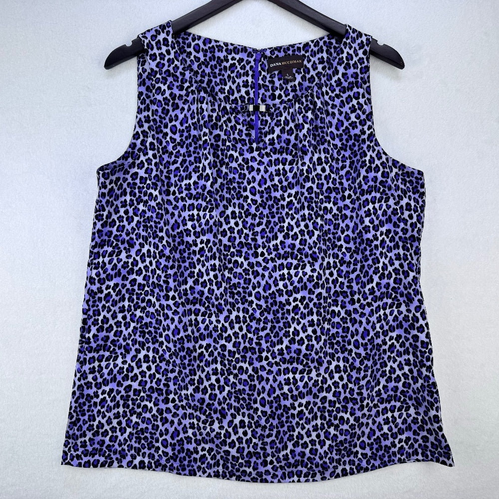A sleeveless leopard-print top in shades of purple, blue, and black, hanging on a black hanger against a light gray textured background.