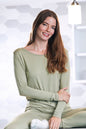 Woman wearing a sage green Spun Bamboo long sleeve lounge T-shirt with a relaxed fit.