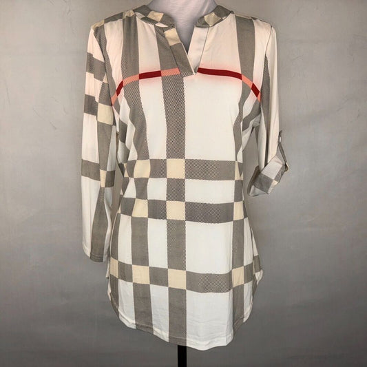 A long-sleeve plaid tunic top with a white, gray, and beige checkered pattern and a thin red stripe across the chest, displayed on a mannequin against a gray background.