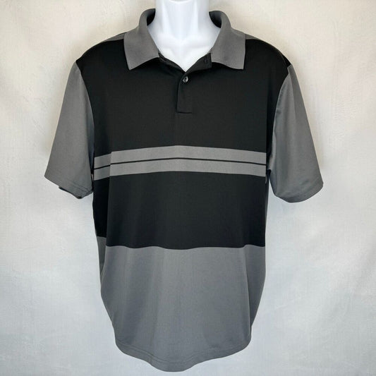 A men's short-sleeve polo shirt in black and gray color blocking, displayed on a white mannequin torso against a light gray fabric backdrop.
