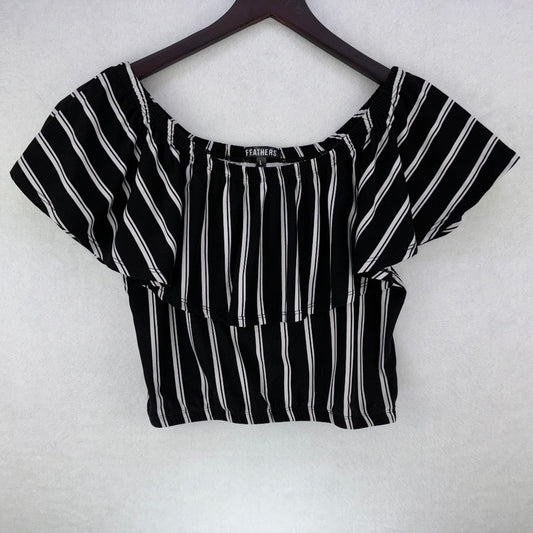 A black and white vertically striped short-sleeve crop top with a square neckline, hanging on a dark wooden hanger against a white textured background.
