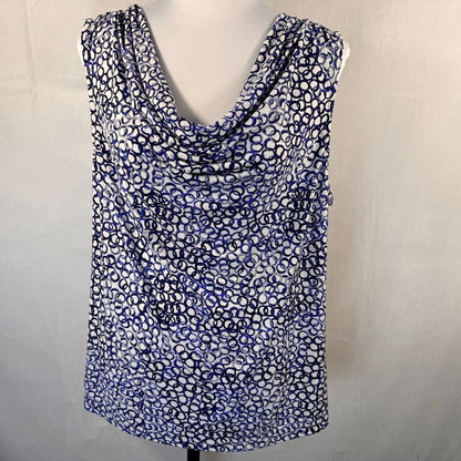 A sleeveless cowl-neck top with an abstract blue, black, and white spotted pattern, displayed on a white dress form against a light gray fabric backdrop.