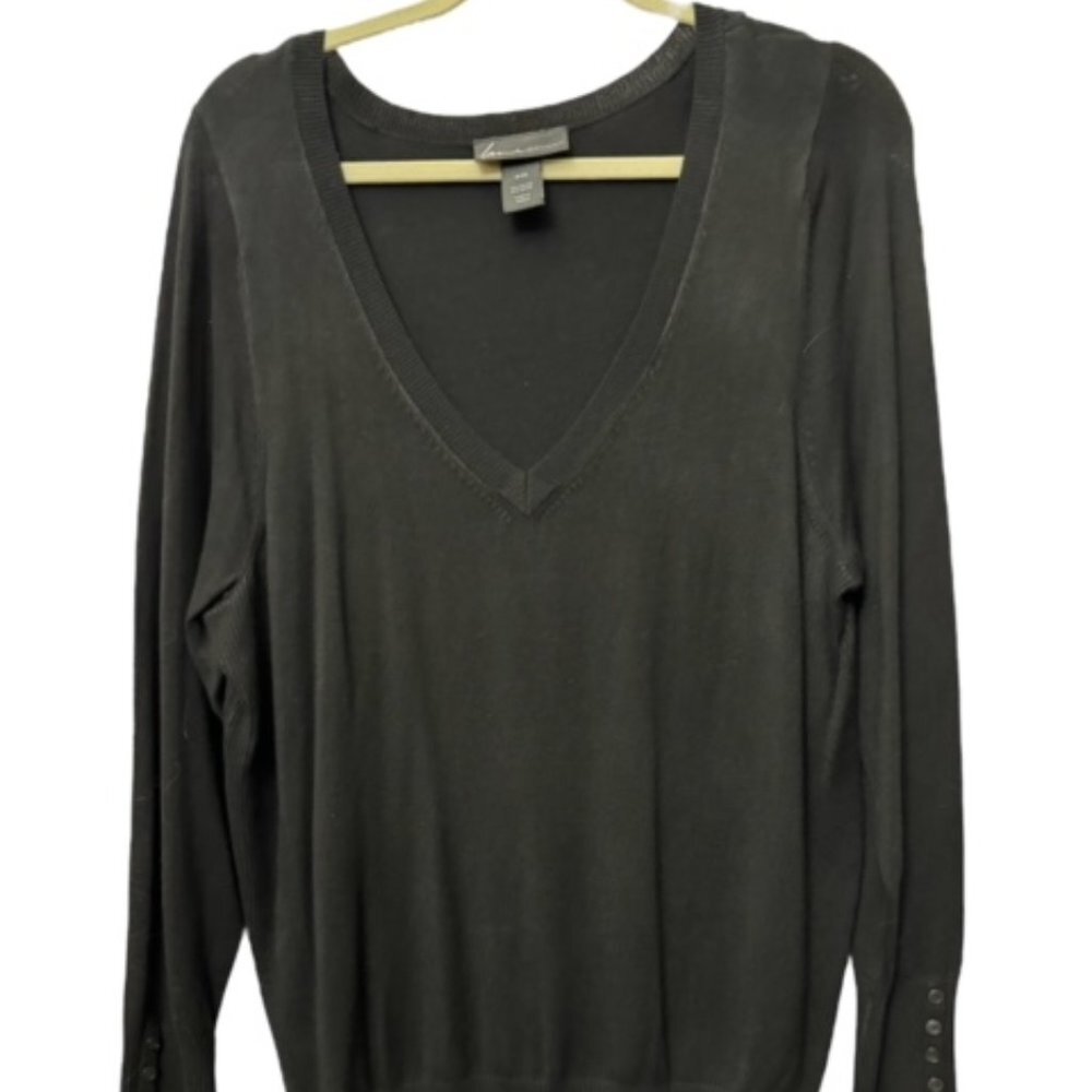 A dark charcoal gray long-sleeve V-neck knit top hanging on a light wood hanger against a white background.