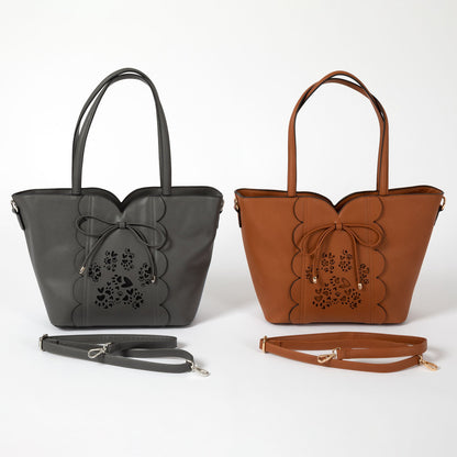 GreaterGood Bow & Hearts Paw Print faux leather handbags in gray and camel, featuring decorative bows, laser-cut paw print designs, top handles and adjustable straps.