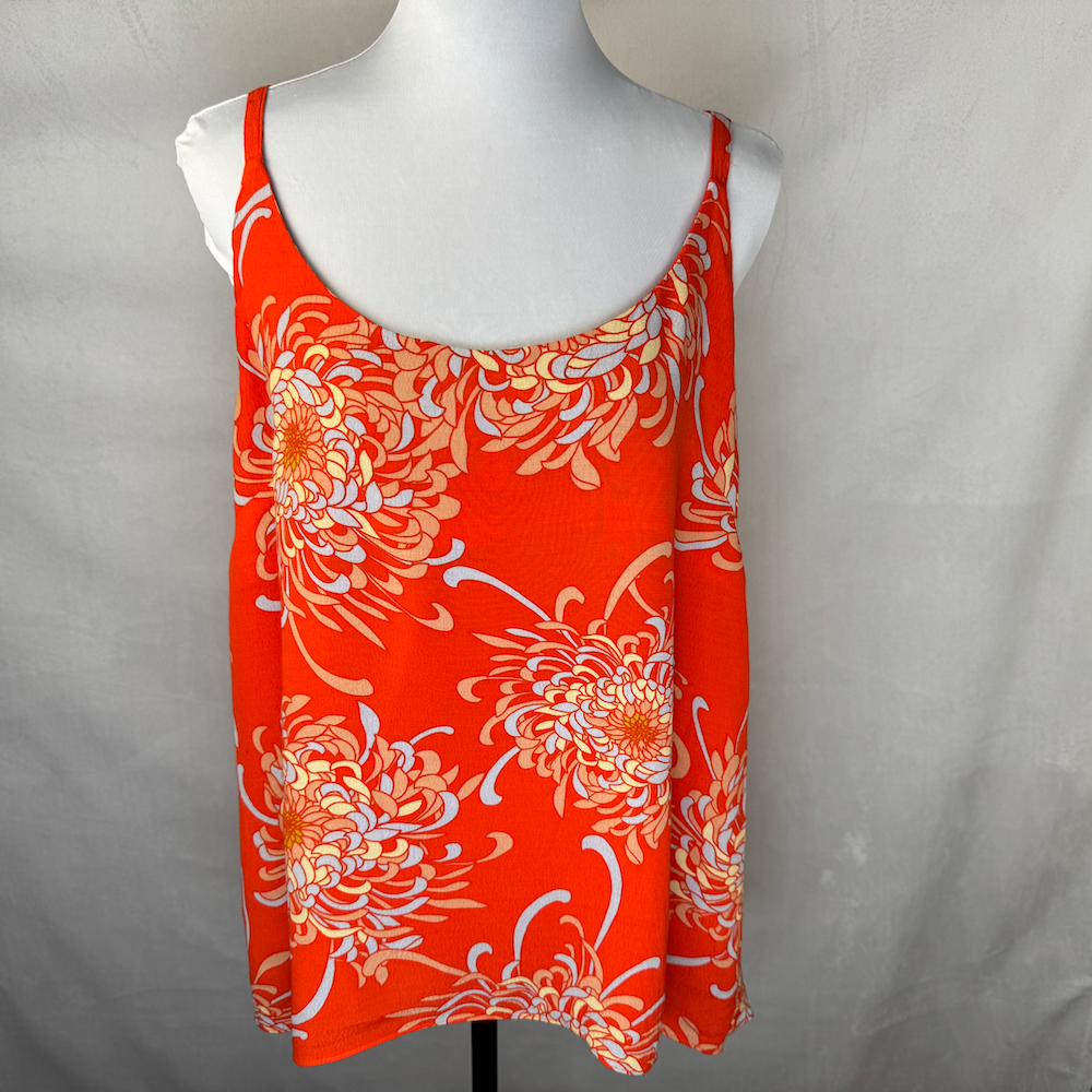 Front view of a Cabi orange top floral print size L