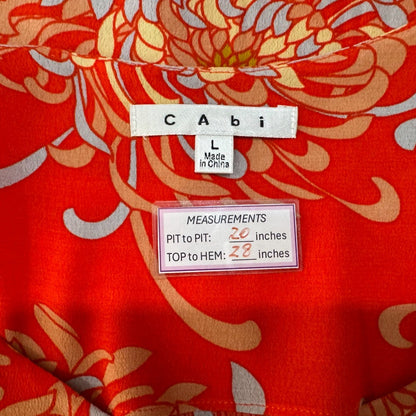 Clothing tag view of red floral patterned fabric with Cabi label and measurements 