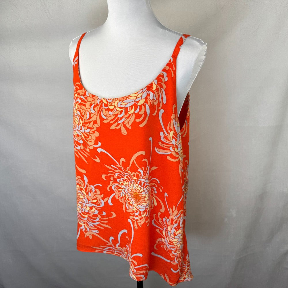 Side view of a Cabi orange floral top on a mannequin against a plain background
