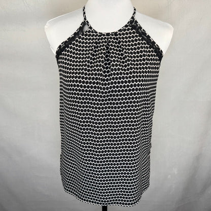 Front view of Candies Black and white patterned top on a mannequin against a gray background