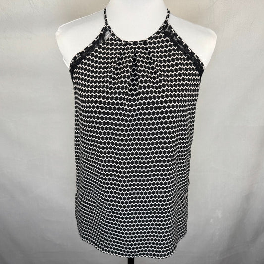 Front view of Candies Black and white patterned top on a mannequin against a gray background